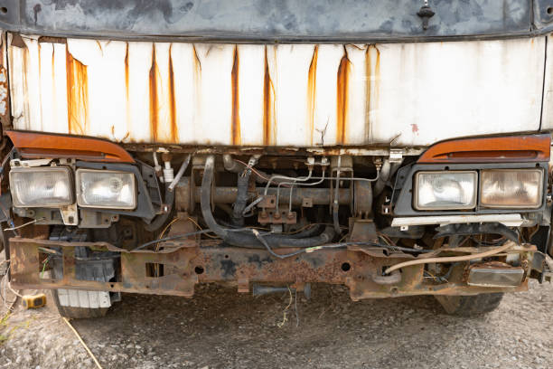 Behind the old brown pickup truck
