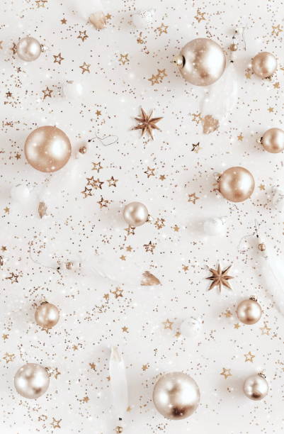 istock Christmas background with Xmas golden decor pattern top view on white backdrop .Beautiful Xmas greeting card. Poster.New Year decoration. 1745860590