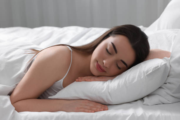 istock Beautiful young woman sleeping in soft bed at home 1745861662