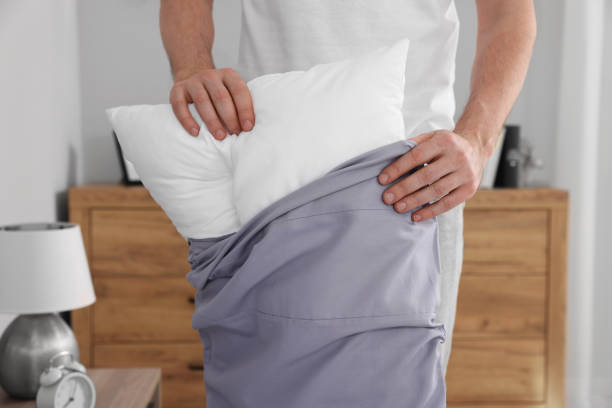 istock Man changing pillowcase at home, closeup. Domestic chores 1745862175