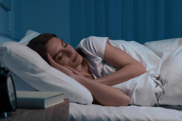 istock Beautiful woman sleeping in bed at night 1745865931