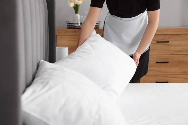 istock Chambermaid making bed in hotel room, closeup 1745881165