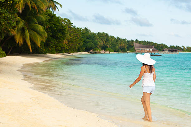 Young girl walking through water stock photo