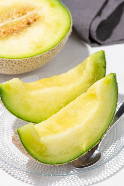 Earls Melon Arranged in Glass Dish After Cutting
