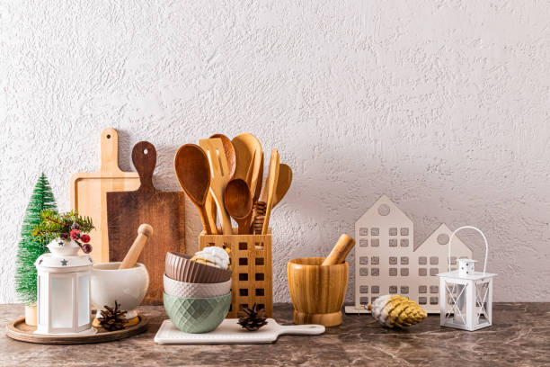 istock Beautiful festive Christmas kitchen background with decor elements on kitchen stone countertop. A copy space. 1745921245