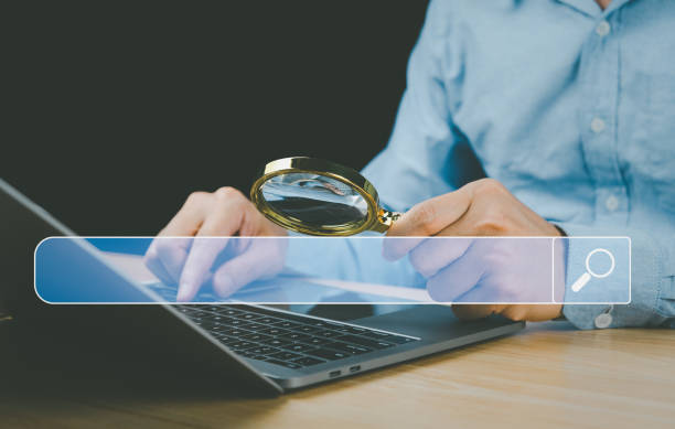 istock magnifying glass business idea on the virtual screen search technology Marketing 1745931298