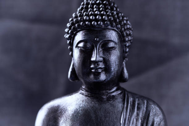 istock Meditating Buddha Statue on dark background. Soft focus. Close up. Copy space. 1745932962