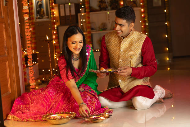 istock Happy couple celebrating Diwali at home 1745942036