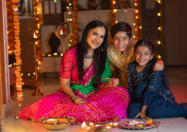 istock Mother with children decorating plate at home 1745942613