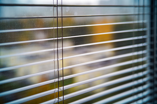 open blinds on the window, indoor cropped shot, shallow DOF