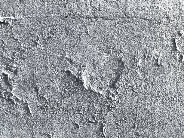 istock Pale grey and white stucco on a concrete wall with a subtle heart shape creating a beautiful organic texture for an abstract background 1745981934