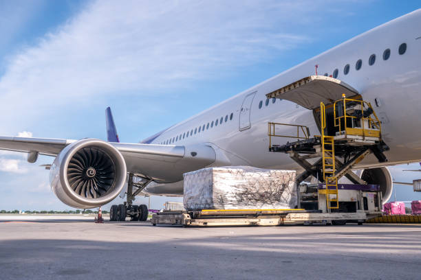 istock Air cargo logistic containers are loading to an airplane. 1745994635