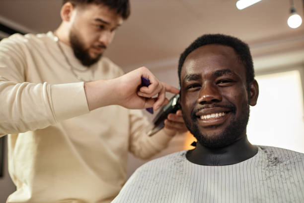 istock Man getting haircut in barber shop 1746018336