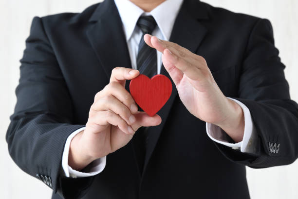 istock Business man holding and guarding heart object 1746020967