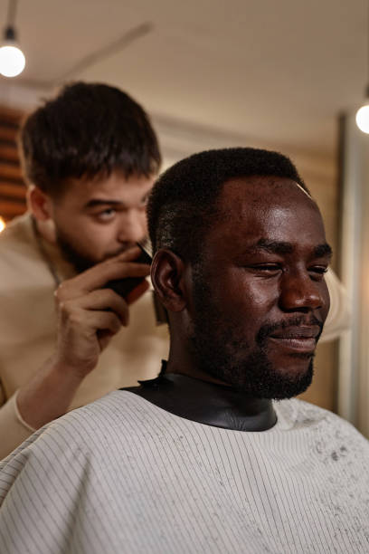 istock Man getting haircut from stylist 1746025400