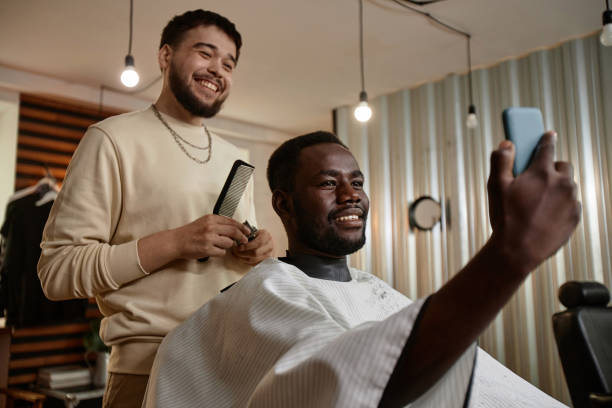 istock Man making selfie portrait with his barber 1746026981