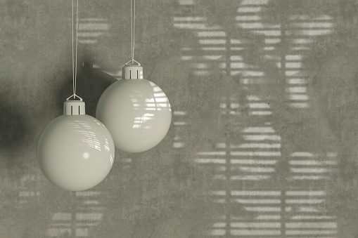 Christmas ornaments on gray color background, new year concept. Digitally generated image.