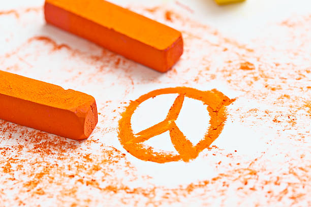 istock Orange pastel sketch of Peace sign on drawing pad 174603206