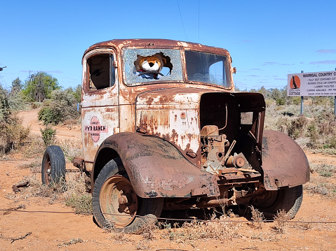 Old rusty truck outside a ranch in Silverton, a small village at the far west of New South Wales, Australia. The town is often referred to as a ghost town, however, there remains a small permanent population and is a film set and popular tourist destination in the area.