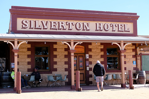 Tourists at the historical Silverton Hotel in Silverton, a small village at the far west of New South Wales, Australia. The town is often referred to as a ghost town, however, there remains a small permanent population and is a film set and popular tourist destination in the area.