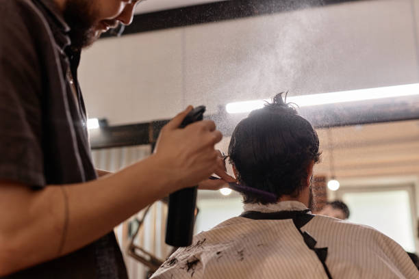 istock Barber making stylish haircut to man 1746051696