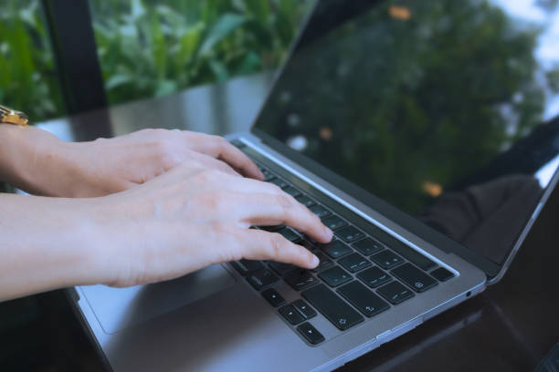 istock Young asian business woman using a notebook to work at the office, co-working space, cafe or work from home. 1746051769