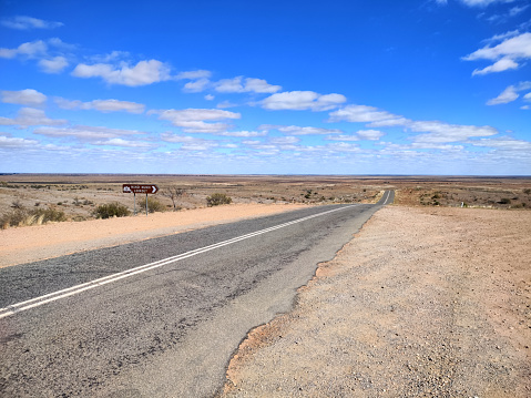 straight road through the dessert of Australia on the Flinders Hightway, Quennsland