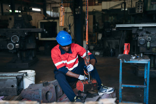 istock Industrial worker inspecting and check up machine at factory machines. Technician working and checking Material or Machine at industry manufactory. 1746067435