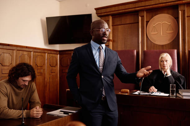 istock Confident attorney in formalwear speaking to prosecution side during trial 1746070299