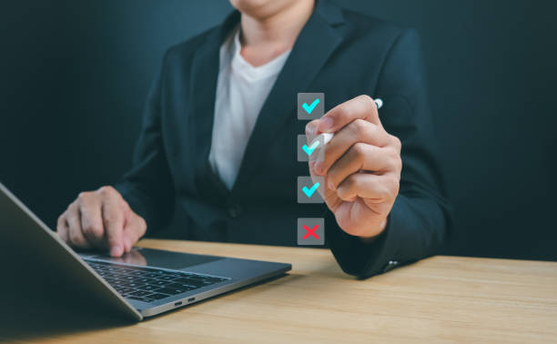 istock Businessman's approval with correct sign mark ensures quality. Online survey 1746073778
