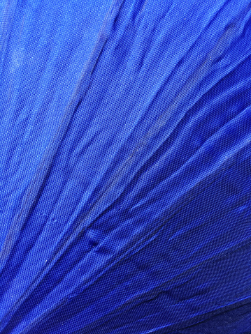 Ultra blue  fabric grainy surface for book cover, linen design element, grunge texture.