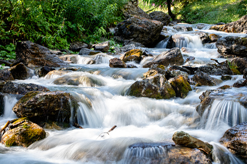 Mountain stream flowing through rocks