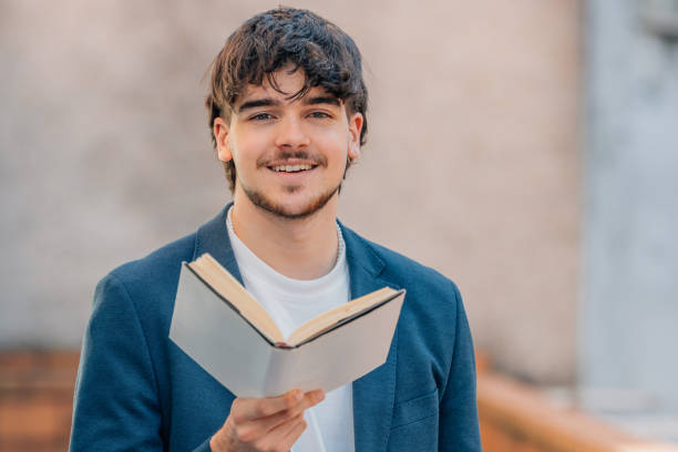 istock student with textbook reading on the street 1746096634