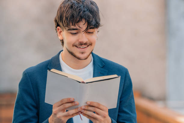 istock student with textbook reading on the street 1746096644