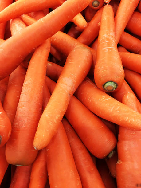istock carrot background/ Fresh carrot isolated 1746102247
