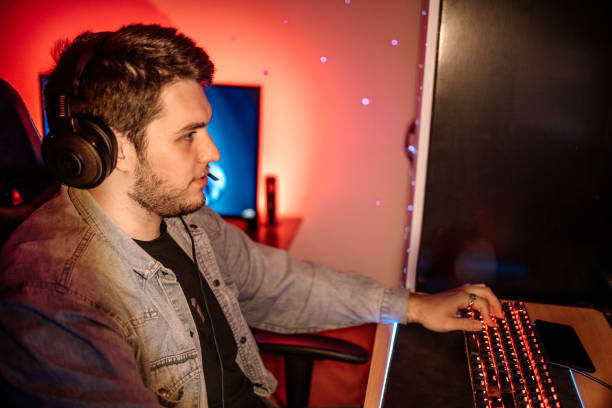 istock Pro gamer playing online games at home with ambient lighting 1746107750