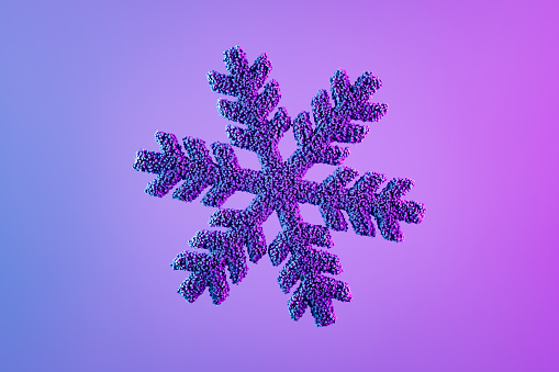 Snowflake shape with particles Christmas ornament on neon background, new year concept. Digitally generated image.