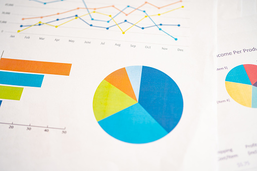 Pen on chart or graph paper. Financial, account, statistics and business data concept.