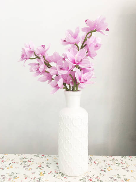 istock Flowers in The vase on floral tablecloth 1746125616