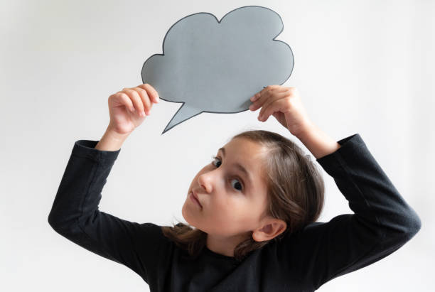 istock Beautiful girl holding blank speech bubble 1746133542