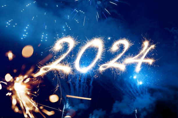 istock Sparkler Happy New Year 2024 with fireworks 1746142302