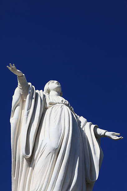 istock White Virgin statue on blue sky background, Santiago, Chile 174614748