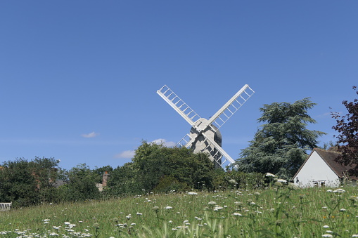 Working windmill against a blue sky