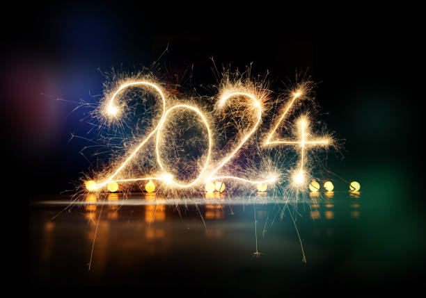 istock Sparkler Happy New Year 2024 with fireworks 1746153511