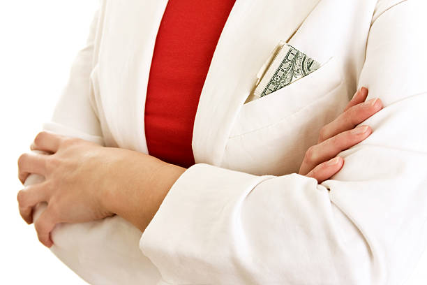 istock women with one dollar 174615477