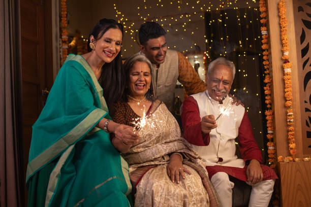 istock Two generation family burning sparklers at home during Diwali 1746155684