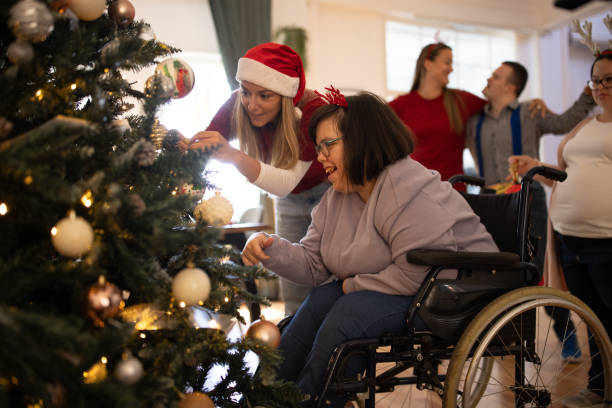 istock People with Down syndrome decorating a Christmas tree with their friends 1746156211