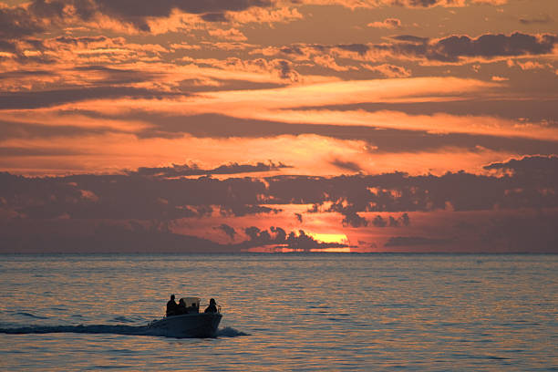 seascape at sunset with motorboat