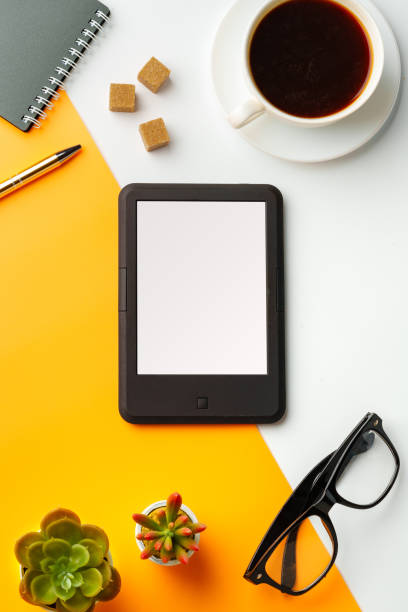 istock E-book reader with coffee cup and glasses on white and yellow background 1746157307