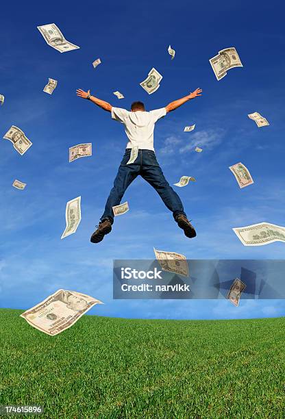 Happy Jumping Man With Falling Dollar Banknotes Stock Photo - Download Image Now - Currency, Jumping, Men